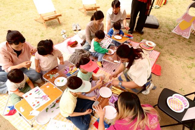 Children participate in a hands-on program at a world literature reading session during the Nami Island International Childrens Book Festival held on Nami Island in Chuncheon Gangwon Province May 10 2026 AJP Han Jun-gu