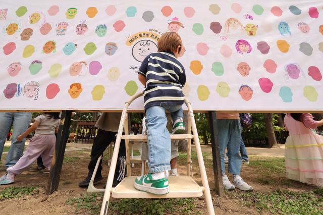 A child draws a picture at the community drawing program during the Nami Island International Childrens Book Festival held on Nami Island in Chuncheon Gangwon Province May 10 2026 AJP Han Jun-gu