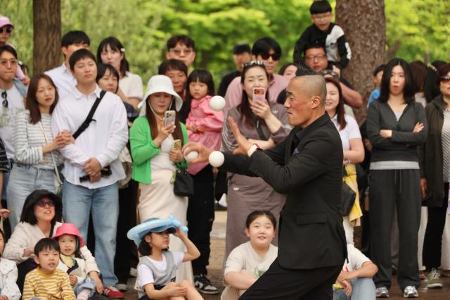 Visitors watch a mime performance at the Nami Island International Childrens Book Festival held on Nami Island in Chuncheon Gangwon Province May 10 2026 AJP Han Jun-gu