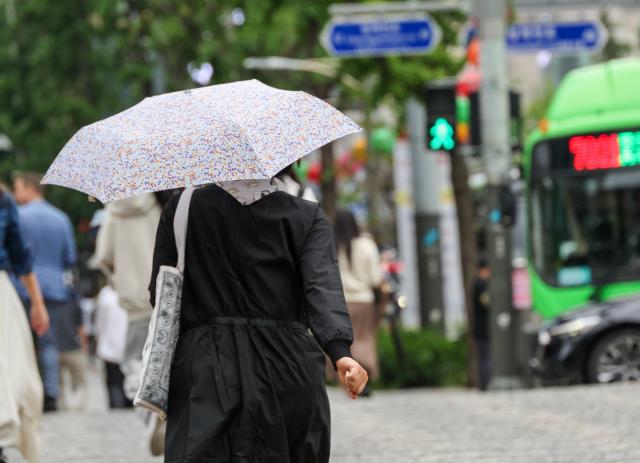 Rain brings relief to Seoul after weeks of early summer heat