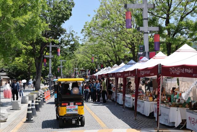 Handcrafted goods shops line a street in Jeonju Hanok Village on May 9 2026 AJP Yoo Na-hyun
