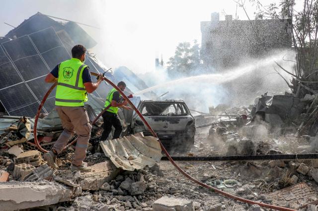 First responders affiliated with the Islamic Risala Scout Association gather at the scene following Israeli bombardment that hit one of their facilities in the village of Arnoun in southern Lebanon on May 12 2026 Israel has intensified its attacks in south Lebanon as it trades fire with Iran-backed Hezbollah despite an April 17 ceasefire between Israel and Lebanon that aimed to halt the fighting AFP-Yonhap 