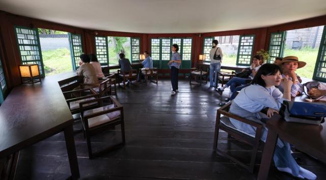 Visitors look around Jibokjae known as King Gojong’s royal library at Gyeongbokgung Palace in central Seoul on May 13 2026 AJP Yoo Na-hyun

