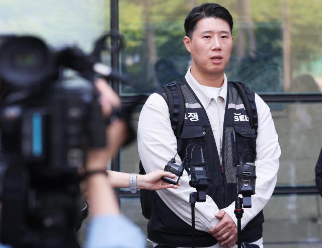 Choi Seung-ho head of Samsung Electronics’ branch of the National Samsung Electronics Union speaks to reporters after attending a court hearing at the Suwon District Court in Suwon Gyeonggi Province on Tuesday regarding Samsung Electronics’ injunction request against the union over alleged illegal strike actions May 13 2026 Yonhap