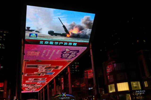 A giant screen shows a news report on Chinas Justice Mission 2025 military drills around Taiwan in Beijing China December 30 2025 REUTERSYonhap