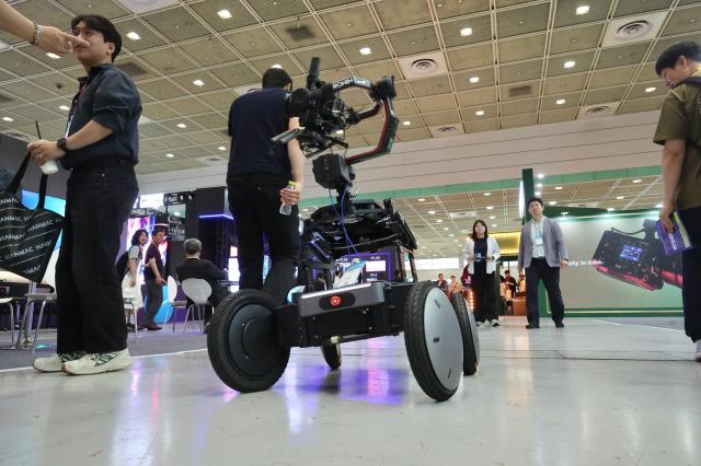A filming robot moves at KOBA 2026 held at COEX in Gangnam-gu Seoul May 14 2026 AJP Han Jun-gu