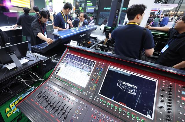 Visitors experience audio equipment at KOBA 2026 held at COEX in Gangnam-gu Seoul May 14 2026 AJP Han Jun-gu
