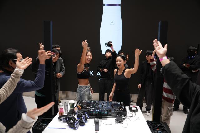 Participants gather for an after-jog morning rave at the YLESS flagship store in Bukchon central Seoul where a DJ performance and beauty experiences drew about 200 attendees March 7 2026 Courtesy of YLESS
