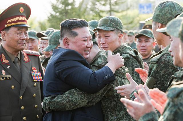 North Koreas Supreme Leader Kim Jong Un 2nd L and North Korean servicemen attend a ceremony to open a museum and memorial complex dedicated to the North Korean servicemen who took part in the liberation of Russias Kursk Region from the Ukrainian Armed Forces Courtesy of the Russian Defense Ministry Press Office