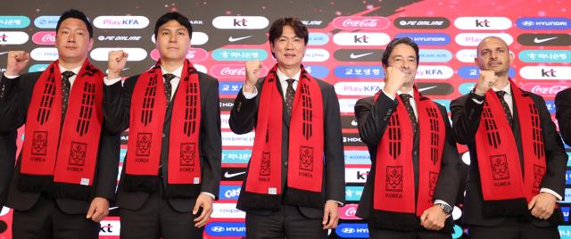 South Korean national football team head coach Hong Myung-bo poses for a commemorative photo with his coaching staff during a press conference announcing the country’s final squad for the 2026 FIFA World Cup at KT Gwanghwamun West Building in Seoul on May 16 2026