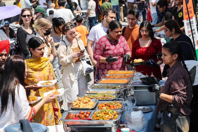 Visitors purchase food at the Indian food truck zone during the inaugural India Day festival held at Mulbit Square in Yeouido Hangang Park on May 16 AJP Yoo Na-hyun