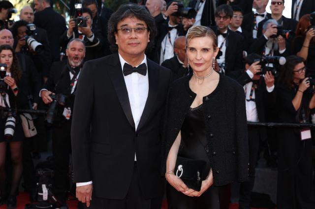 South korean director Bong Joon-Ho and Marrakech festival director Melita Toscan Du Plantier arrive for the Opening Ceremony and the screening of the film La Venus electrique The Electric Kiss at the 79th edition of the Cannes Film Festival in Cannes southern France on May 12 2026 AFP-Yonhap 
