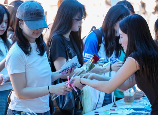 Students take part in a Coming-of-Age Day celebration event at Chung-Ang University in Seoul’s Dongjak District on May 18 AJP Yoo Na-hyun