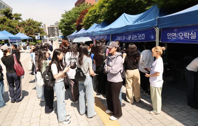 Students take part in a Coming-of-Age Day celebration event at Chung-Ang University in Seoul’s Dongjak District on May 18 AJP Yoo Na-hyun