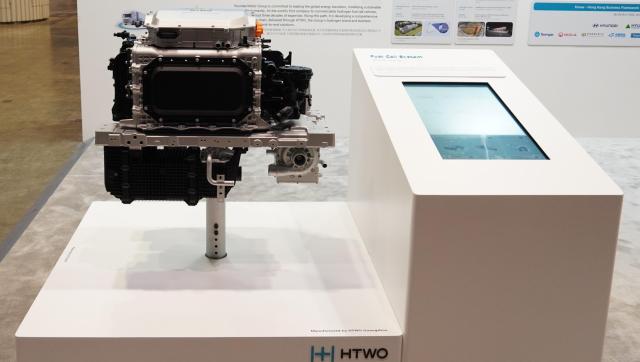 This photo provided by Hyundai Motor Group shows the company’s HTWO exhibition booth featuring its hydrogen business platform and waste-to-hydrogen business solutions at the International Hydrogen Development Symposium 2026 in Hong Kong