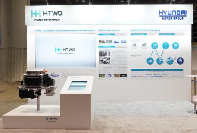 This photo provided by Hyundai Motor Group shows the company’s HTWO exhibition booth featuring its hydrogen business platform and waste-to-hydrogen business solutions at the International Hydrogen Development Symposium 2026 in Hong Kong