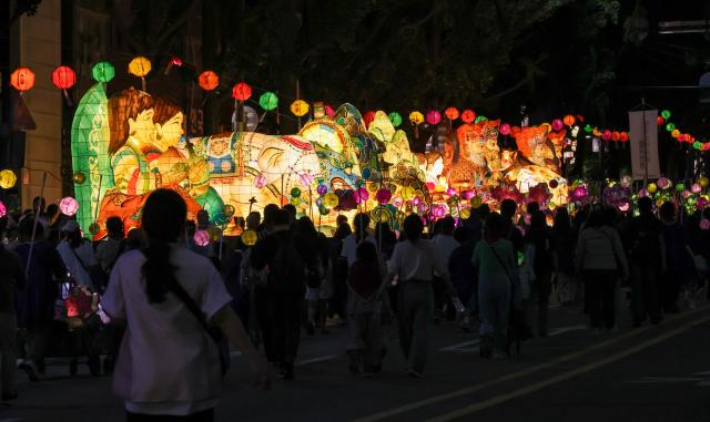 Participants take part in the Yeondeunghoe lantern parade near Bosingak in Seoul’s Jongno District on May 16 2026 ahead of Buddhas Birthday AJP Yoo Na-hyun