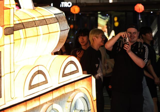Participants take part in the Yeondeunghoe lantern parade near Bosingak in Seoul’s Jongno District on May 16 2026 ahead of Buddhas Birthday AJP Yoo Na-hyun