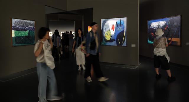 Visitors view works during the retrospective exhibition of Korean abstract art pioneer Yoo Youngkuk at Seoul Museum of Art Seosomun Main Branch in central Seoul on May 19 2026 AJP Yoo Na-hyun