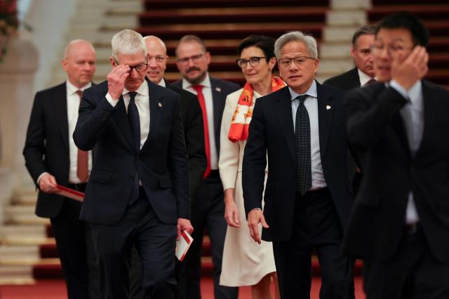  Nvidia CEO Jensen Huang 3-R Apple CEO Tim Cook 2-L and Citi CEO Jane Fraser arrive for the meeting between Chinese Premier Li Qiang and US business representatives at the Great Hall of the People in Beijing China 14 May 2026 US President Trump is in Beijing for a high-stakes state visit running through 15 May marking his first return to the mainland since 2017 EPAYonhap