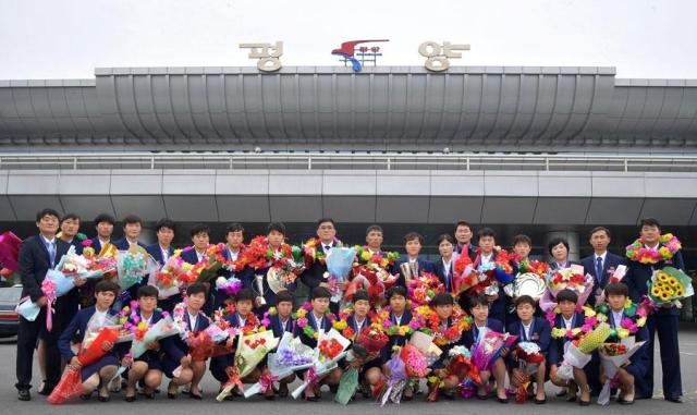 North Korean footballers get heros welcome home after record fifth Asian Cup title
