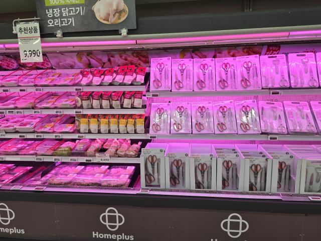 Refrigerated poultry shelves stacked with kitchen scissors at Homeplus Hwaseong Gyeonggi Province AJP Kim Dong-young 