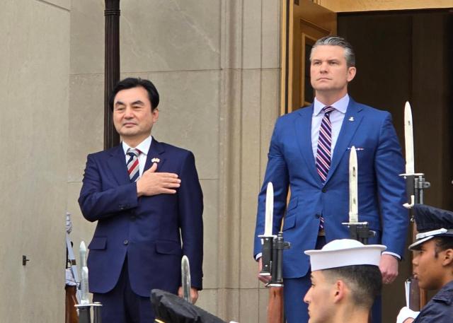 South Korean Defense Minister Ahn Gyu-back left and US Secretary of Defense Pete Hegseth attend a ceremony before their talks at the Pentagon near Washington DC on May 11 2026 Yonhap