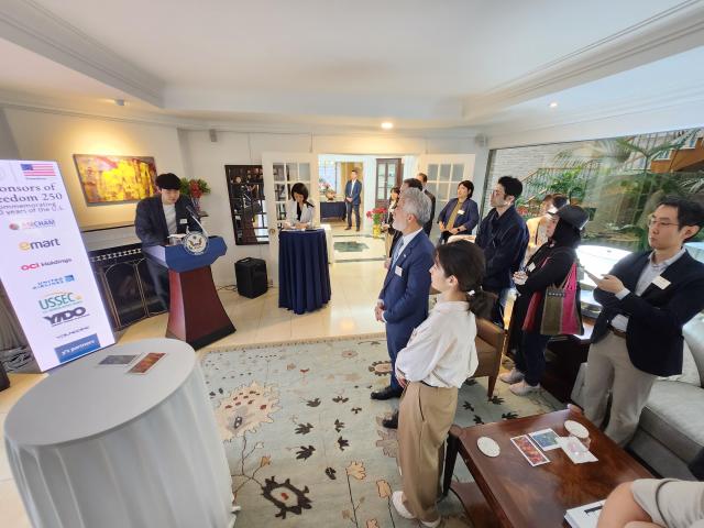 South Korean contemporary artist Park Ju-eon speaks about his works at the US Charge dAffaires residence near central Seoul on May 20 The installation is part of a special exhibition hosted by the United States Embassy for the Freedom 250 campaign AJP Park Sae-jin