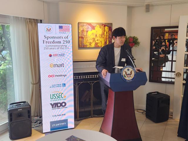 South Korean contemporary artist Park Ju-eon speaks about his works at the US Charge dAffaires residence near central Seoul on May 20 The installation is part of a special exhibition hosted by the United States Embassy for the Freedom 250 campaign AJP Park Sae-jin