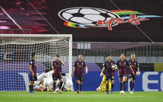 Players of Naegohyang Women’s Football Club celebrate after Choe Kum-ok scores an equalizer against Suwon FC Women during their AFC Women’s Champions League semifinal match at Suwon Sports Complex in Suwon Gyeonggi Province on May 20 2026 while Suwon players react in disappointment Courtesy of Yonhap News Agency