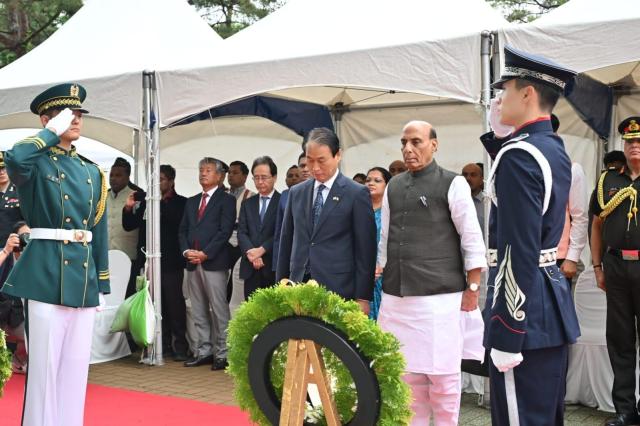 South Korean Patriots and Veterans Affairs Minister Kwon Oh-eul left and Indian Defense Minister Rajnath Singh pay tribute during a commemorative ceremony for the Indian War Memorial at Imjingak in Paju South Korea on May 21 2026 