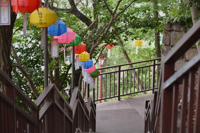Colorful lanterns hang along a stairway at Hyangiram Hermitage in Yeosu, South Jeolla Province, on May 24, 2026, for Buddha’s Birthday. AJP  Joonha Yoo
