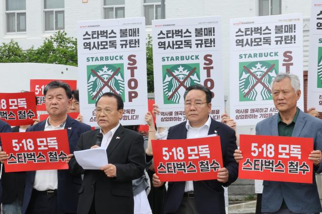 Members of the May 18 Memorial Foundation and three organizations representing victims merit recipients and bereaved families of the May 18 Gwangju Democratization Movement hold a press conference at May 18 Democracy Square in Gwangju on May 26 2026 condemning Starbucks Korea and Chung Yong-jin over the company’s controversial marketing campaign accused of trivializing the historic uprising Yonhap