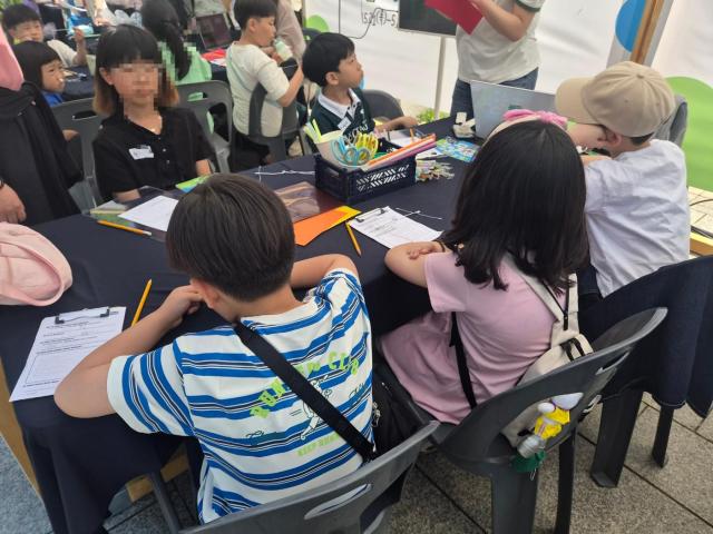 Children engaged in the 'Future Sensation - Sculpting the Movements of Nature' program during the 2026 Cultural Diversity Week event.