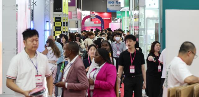 Visitors look around booths during the 2026 Seoul International Cosmetics  Beauty Industry Expo CosmoBeauty Seoul and International Health Industry Expo at COEX in Seoul’s Gangnam district on May 27 2026 AJP Yoo Na-hyun
