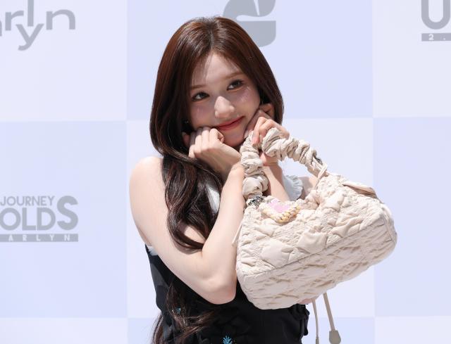 LEESEO of K-pop girl group IVE poses for a photo during a promotional event for fashion brand CARLYN at the brand’s Hongdae flagship store in Seoul on May 29 2026 AJP Yoo Na-hyun