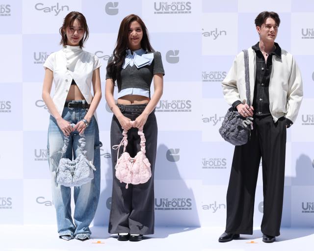 From left Thai actors EMI BONNIE and MIK pose for a photo during the opening event for fashion brand CARLYNs Hongdae flagship store in Seoul on May 29 2026 AJP Yoo Na-hyun