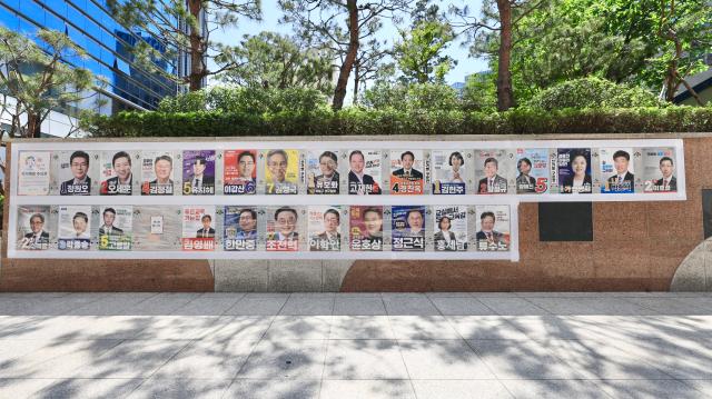 Campaign posters line a wall in Seongsu-dong Seoul on May 22 2026 AJP Han Jun-gu