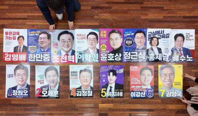 Officials inspect election posters at the Seoul Election Commission in Jongno-gu Seoul on May 20 2026 AJP Yoo Na-hyun