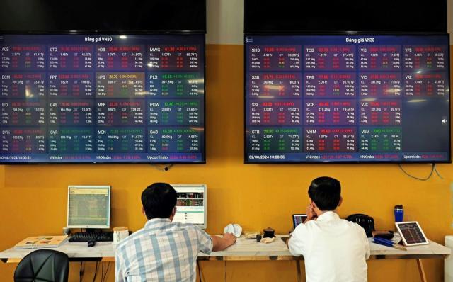 A customer trades at the Bao Viet Securities headquarters in Hanoi