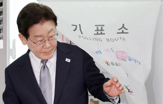 President Lee Jae-myung exits the polling station after voting on the first day of early voting for the 9th nationwide local elections on May 29 at a community center in Jongno-gu, Seoul.