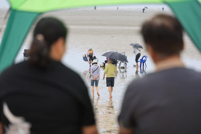 Visitors rest at Hanagae Beach in Jung-gu Incheon on June 1 2026 AJP Han Jun-gu