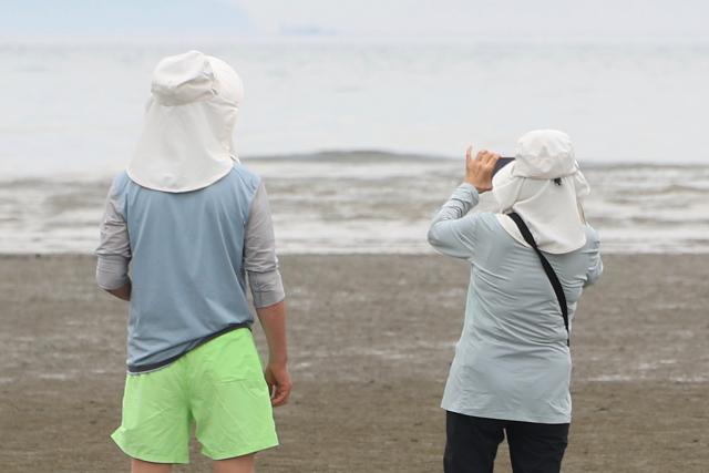 A visitor photographs the sea at Hanagae Beach in Jung-gu Incheon on June 1 2026 AJP Han Jun-gu