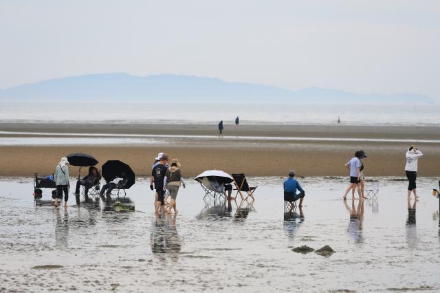 Visitors enjoy the sea at Hanagae Beach in Jung-gu Incheon on June 1 2026 AJP Han Jun-gu