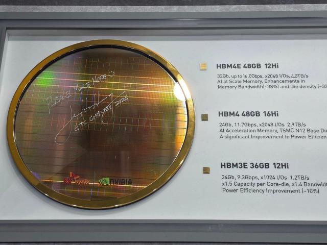 Jensen Huang, CEO of NVIDIA, signs the next-generation high-bandwidth memory product 'HBM4E wafer' at the SK Hynix exhibition booth during Computex 2026 in Taiwan on June 2.