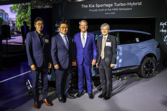 From left HMGMA CEO Tony Heo Kia North America and Kia America President and CEO SeungKyu Yoon Georgia Gov Brian P Kemp and Korean Consul General in Atlanta Lee Jun-ho pose during a ceremony marking the start of Kia Sportage Hybrid production at Hyundai Motor Group Metaplant America in Ellabell Georgia Courtesy of Kia