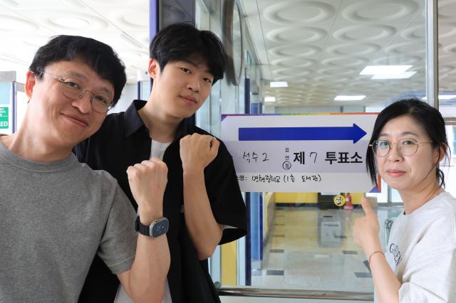 Voters take commemorative photos after casting their ballots at Polling Station No 7 in Seoksu 2-dong Anyang Gyeonggi Province on June 3 2026 AJP Han Jun-gu