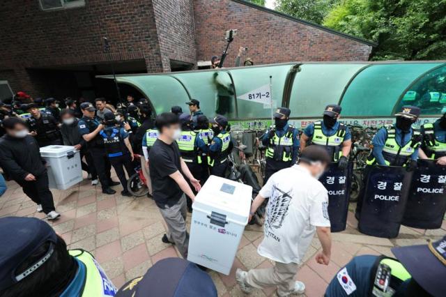 Police disperse protesters, secure ballot boxes after election day disruption in Seoul