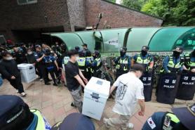 Police disperse protesters, secure ballot boxes after election day disruption in Seoul