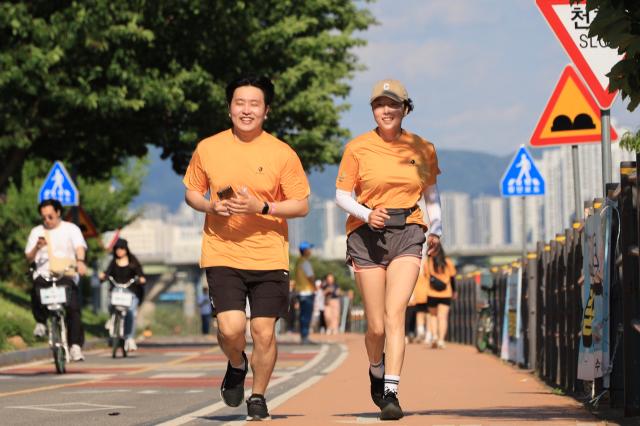 Participants run during the 2026 My Pace Hangang Triathlon Festival held at Ttukseom and Jamsil Han River Parks in Seoul on June 5 2026 AJP Han Jun-gu
